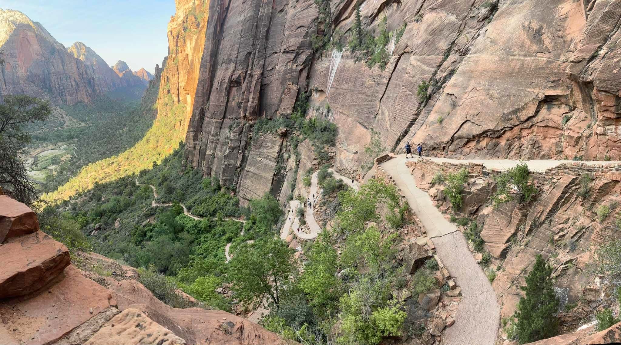 A winding cliffside trail overlooking a canyon