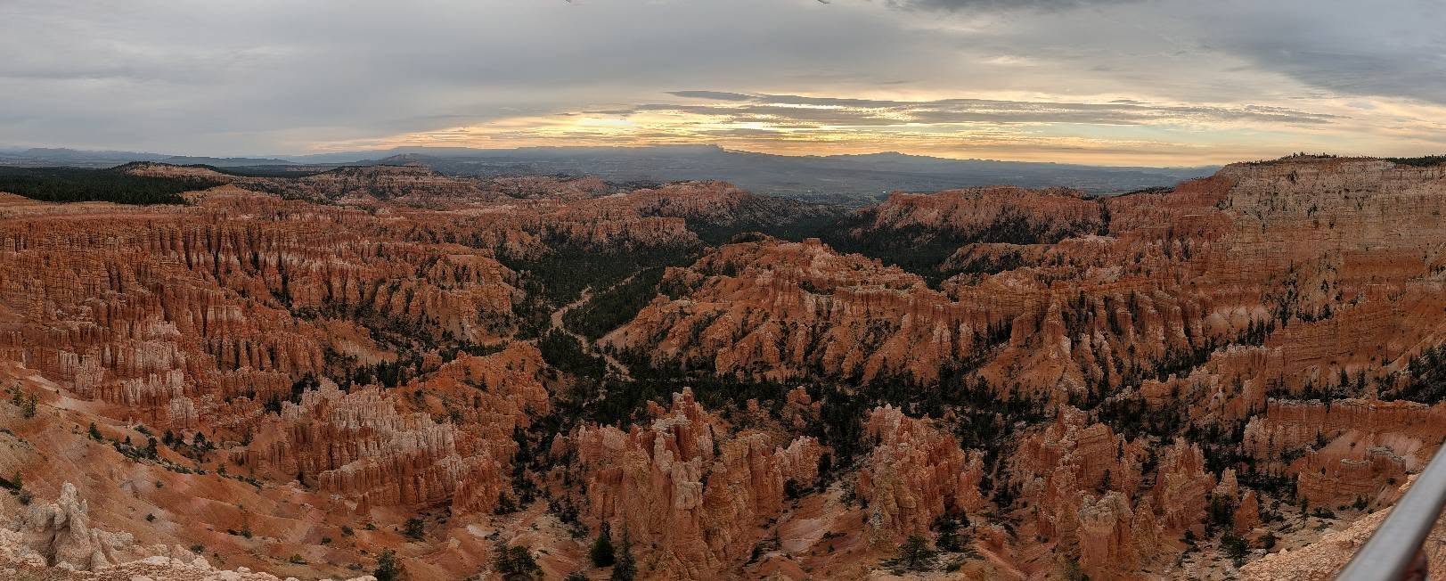 Layered canyon cliffs under warm evening light