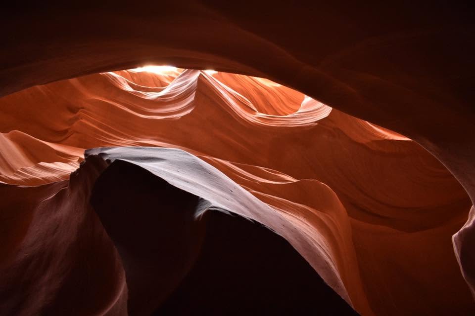 Light beaming into a sandstone slot canyon